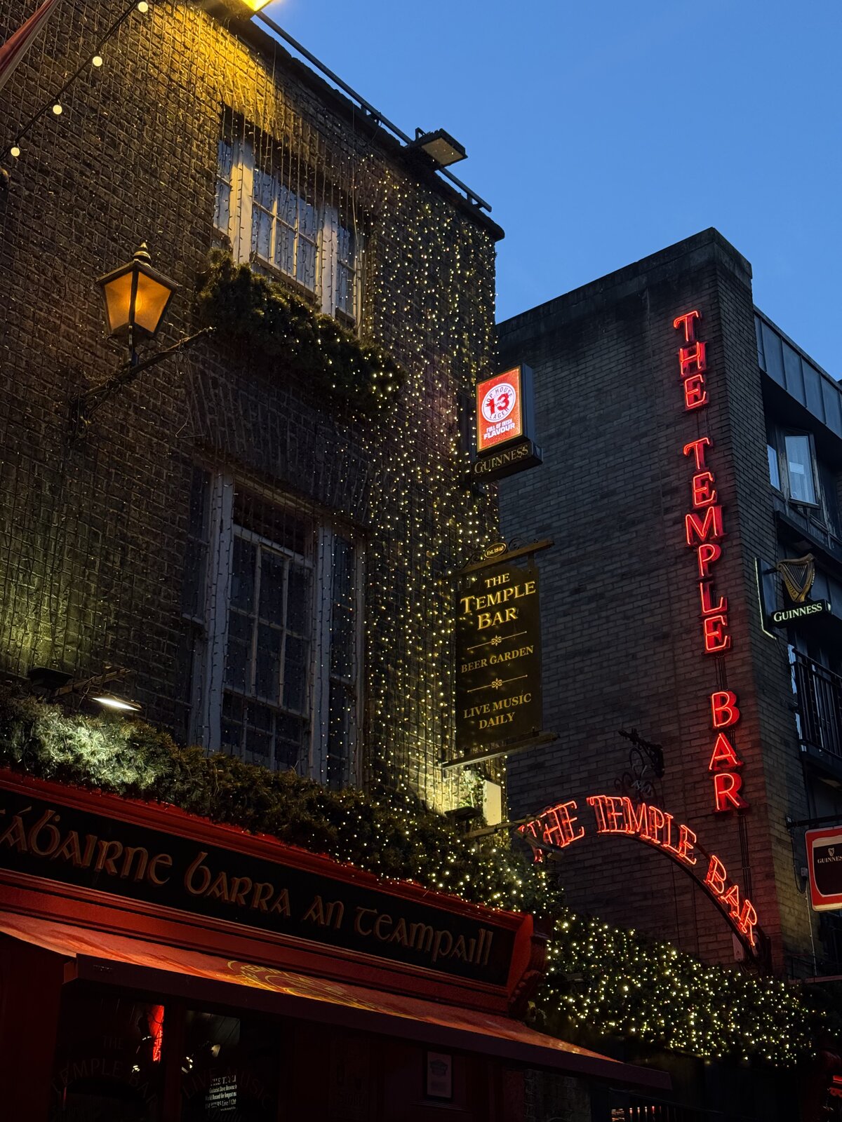 The Temple Bar pub in Dublin lit up at dusk