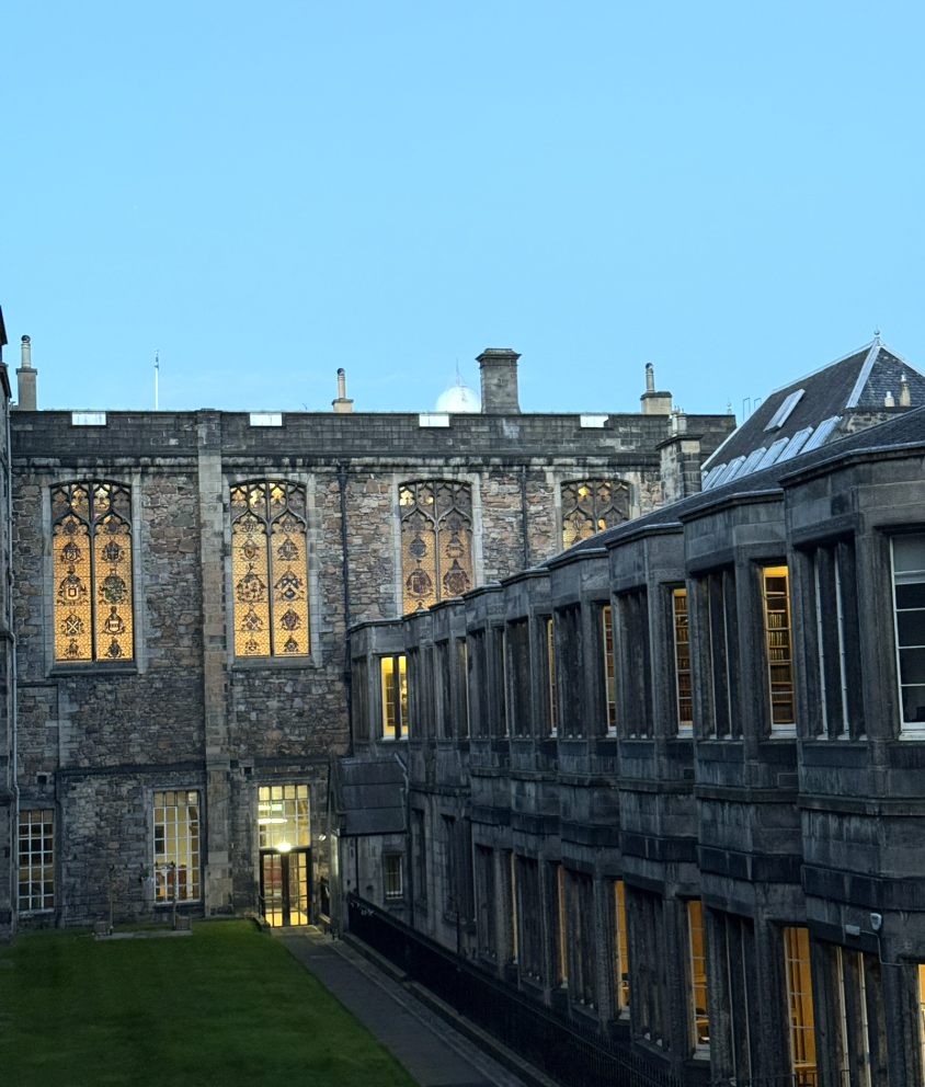 Glowing windows around Edinburgh's Old College courtyard