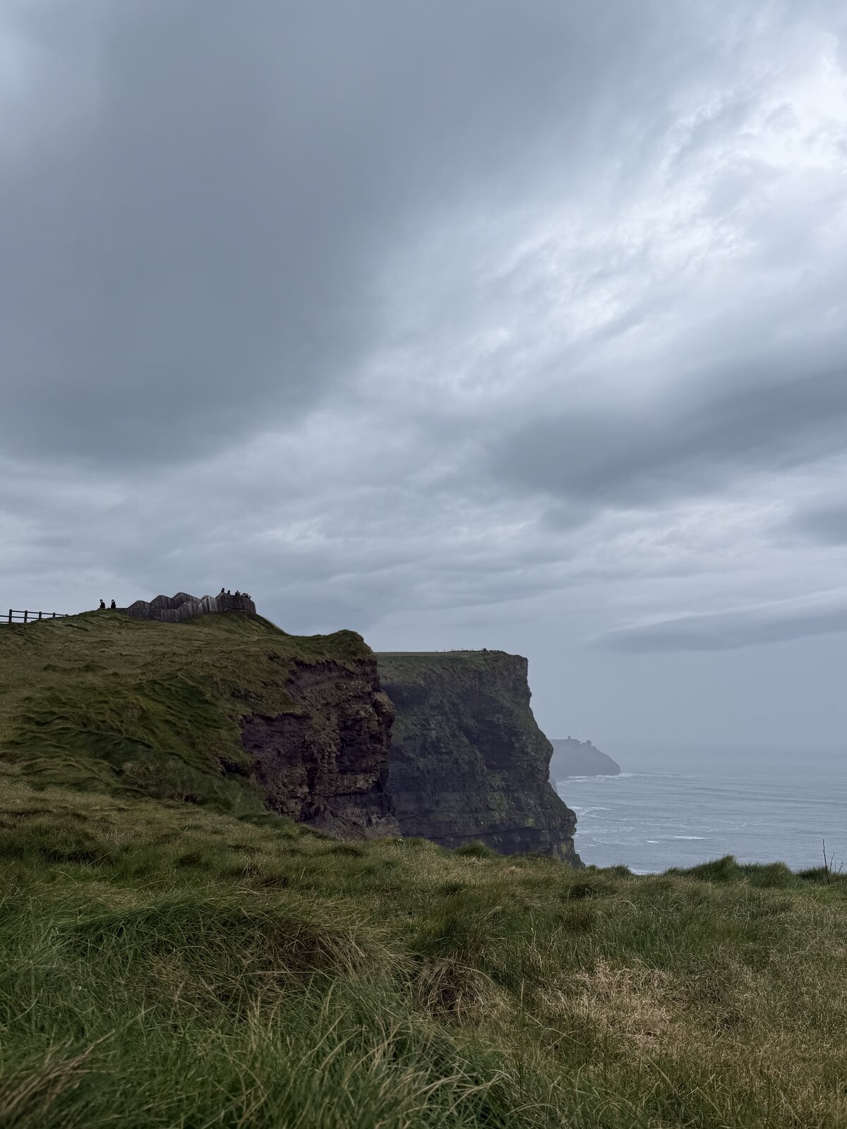 Cliff edge and O'Brien's Tower at the Cliffs of Moher